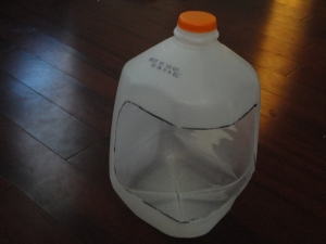 Rectangle cut out of milk jug. 